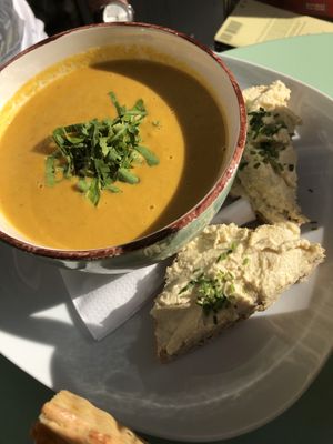 Carrot, coconut and cumin soup... with hummus and bread to dip. Yum! at Flowers Kitchen in Luxembourg City