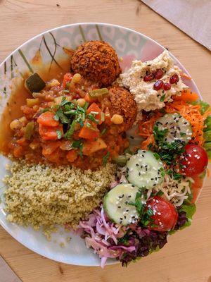 Smokey bean patties with millet, tajine, hummus and salad at Flowers Kitchen in Luxembourg City