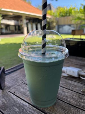 Coconut milkshake with spirulina   at The Cashew Tree in Pecatu