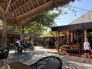 All the seatings are arranged around a courtyard. Very chill and cozy vibe.  at The Cashew Tree in Pecatu