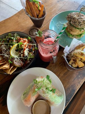 Vegan rice paper rolls, falafel bowl (that they can make vegan), watermelon juice, fries and vegetarian chickpea burger. - SO GOOD  at The Cashew Tree in Pecatu