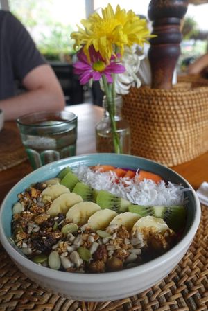 Mixed berry smoothie bowl topped with granola, fresh fruit and coconut at The Cashew Tree in Pecatu