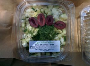 black olive pizza: cucumber,kalamata olives,fennel with crust made of walnuts,zuchinni and almond pulp at Que SeRaw SeRaw in Burlingame