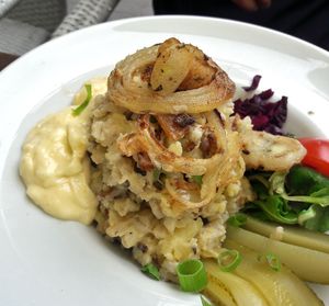 Traditional creamy mashed potatoes with groats - caramelized onions, fried vöner, pickels, 6,80 euros at Kohvik Kroon in Parnu