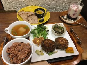 Lentil burger set, hummus and bread side with a black current and soy milk drink.  at Kissa Saeki in Hiroshima