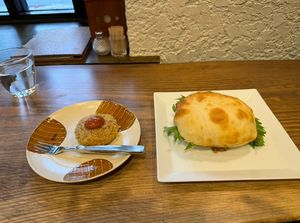 The bun looks freakishly big, but the patty inside was very good!  at Kissa Saeki in Hiroshima