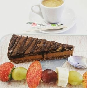 brunch 3/3 : the amazingly delicious chocolate caramel raw cake  and a coffee.  at Sweet Rawmance in Paris
