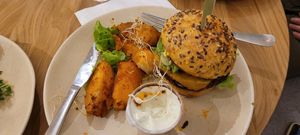 Corn bread burger and potatoes. at Sweet Rawmance in Paris