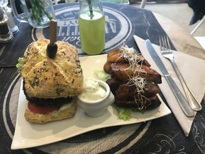 Vegan cheese burger with potatoes ! at Sweet Rawmance in Paris