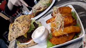 cheese burger with delicious sauce at Sweet Rawmance in Paris