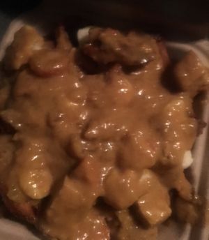 Indian curry-tofu-vegan cheese fry bowl at PBJ Grilled - Food Truck in Portland