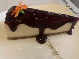 Amazing cheesecake with blueberry sauce ￼  at Level Veggie Bistro in Madrid