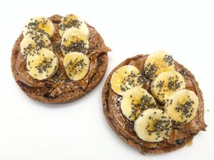 Almond butter toast on gluten-free bread with chia seeds, banana and local raw honey  at The Juice Place in Charlottesville