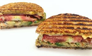 Panini with housemade hummus, avocado, tomato on gluten-free bread  at The Juice Place in Charlottesville