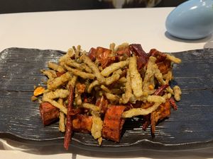 Fried mushrooms. Not very good. Tasted lil spiced up McDonald’s fries   at Ruolanci Vegetarian 若蘭慈素食馆(欢乐海岸店) in Shenzhen