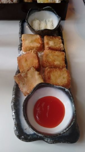 Side of fried tofu on white cabbage at Jiu Pin Lian in Central Singapore
