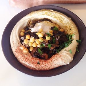 Hummus with portobello - highly recommended! at Umm Kulthum in Haifa