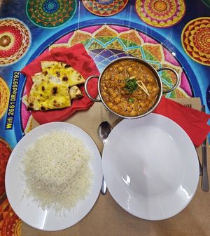 Garlic nan, chana masala (with chickpeas) and basmati rice, really good! at Red Chilli Indian Restaurant in Corfu