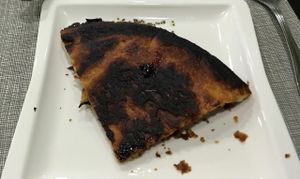 Bottom of my quiche.  I didn't eat it, and they charged me for it anyway!  at La Vita e Vegan in Escaldes-engordany