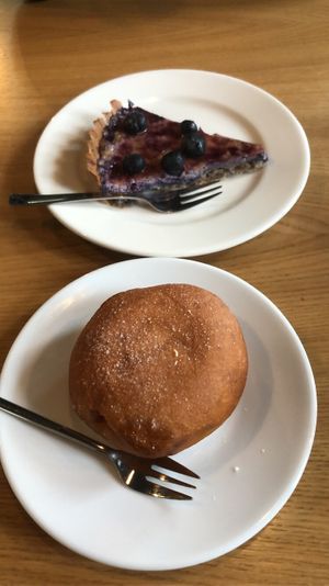 Blueberry tarte + rose jelly donut  at Cocina Verde in Krakow
