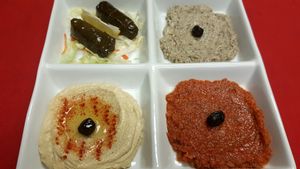 Meze platter:
Humus, babagannush, salsa and grspe leaves. at Mediterrano Turkish and Mediterranean Cuisine in Hillsborough