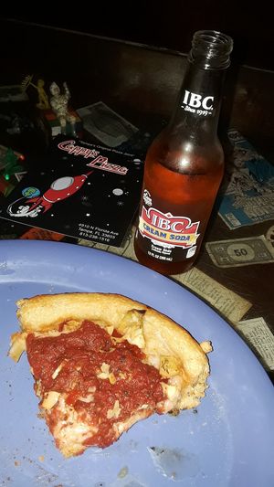 IBC cream soda, a slice of vegan deep dish pizza with artichoke, sun-dried tomatos, & roadted garlic. at Cappy's Pizzeria - Seminole Heights in Tampa