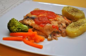 Eggplant Parmigiana with potatoes with herbs and salad at Naturlandia in Lima
