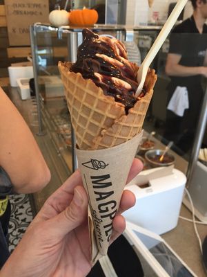 Vegan candy corn and chocolate swirl with vegan fudge at Magpies Softserve in Los Angeles