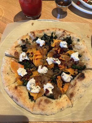 Vegan pizza w/ Squash + ricotta  + caramelized onions   at True Food Kitchen - W Ave in Austin