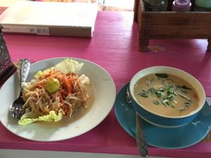 Papaya salad on left, Tom Yam soup on right  at Bodhi Tree Cafe in Chiang Mai