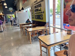 Tables for eating your wares  at Whole Foods Market in Bedford