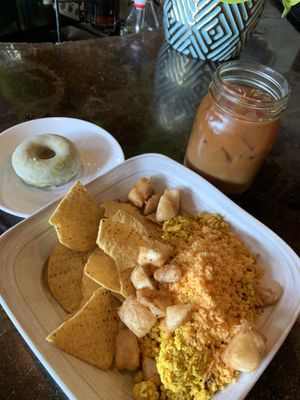 Vegan breakfast burrito bowl, matcha donut, and cold brew coffee with oat milk and maple cinnamon syrup  at The Corner Beet in Denver