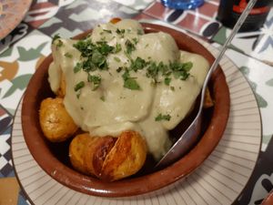 Starter / Patatas con cabrales (media ración) at Distrito Vegano in Madrid