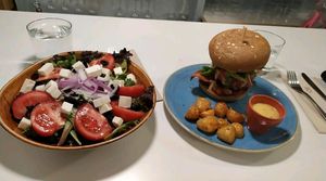 Greek salad & Burguer at Distrito Vegano in Madrid