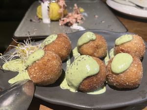 croquetas de parmesano y tomate seco  at La Encomienda in Madrid