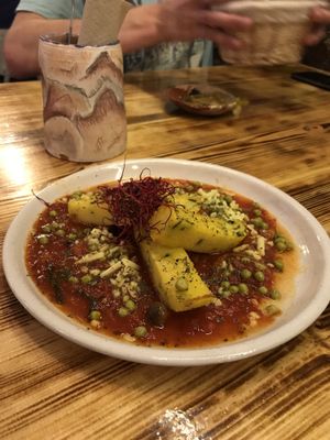 Polenta con salsa napolitana y guisantes (@_beluna)  at La Encomienda in Madrid
