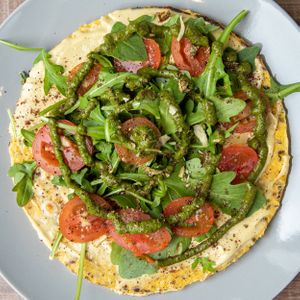 Capresse Arepa with cashew cream cheeze and raw in house pesto. at Manna Life Food in Miami