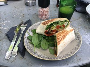 Wrap with hummus, baby spinach, grilled vegetables and avocado (has to be asked without cheese to be vegan) at Manna Manna in Brasov