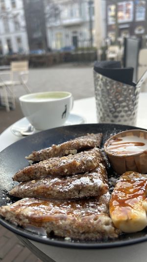 Vegan caramelized banana pancakes with coconut yogurt, really sweet and rich, enjoyed it!  at Club Vers in The Hague