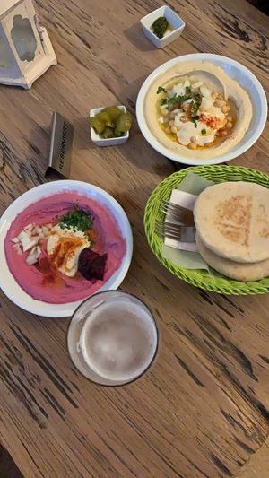 Beetroot hummus, chickpea hummus, included pita at Hummus & Friends in Berlin