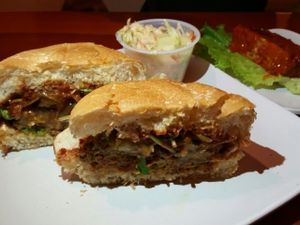 green bar burger with side of Buffalo wings at Rawlicious Rachel in Hollywood