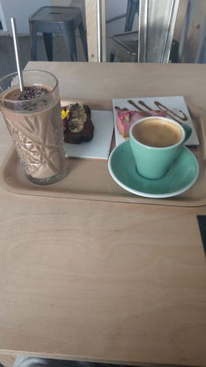 Breakfast menu with coffee, smoothie, banana bread and raw cake at Oh my Goodness in Helsinki