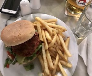 vegan burger & fries! their homemade beet patty & avocado  at Distrato Cafe in Paros