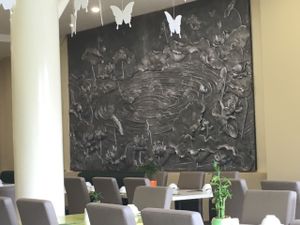 Wall carving.  at Loving Hut Hoa Dang Express Food in Ho Chi Minh City