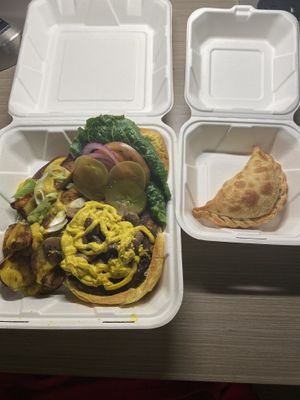 Southwest Black Bean Burger with Loaded Potatoes; Impossible Empanada  at Holi Vegan Kitchen in North Miami Beach