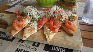 CAPRESE FLATBREAD PIZZETTA
mozzarella, tomato, basil  at Holi Vegan Kitchen in North Miami Beach