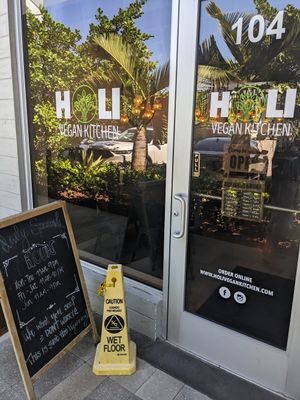 Entrance from the parking lot at Holi Vegan Kitchen in North Miami Beach