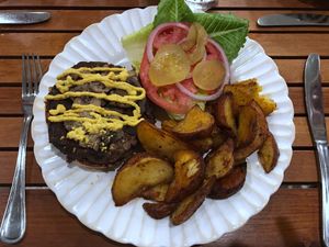 southern black bean burger w/ potato wedges :)  at Holi Vegan Kitchen in North Miami Beach
