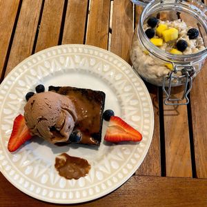 Brownie with ice cream and coconut rice pudding at Holi Vegan Kitchen in North Miami Beach