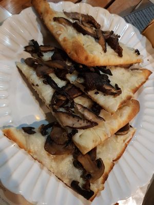 Mushroom Pizzetta, sooo good! The cheese was amazing. at Holi Vegan Kitchen in North Miami Beach